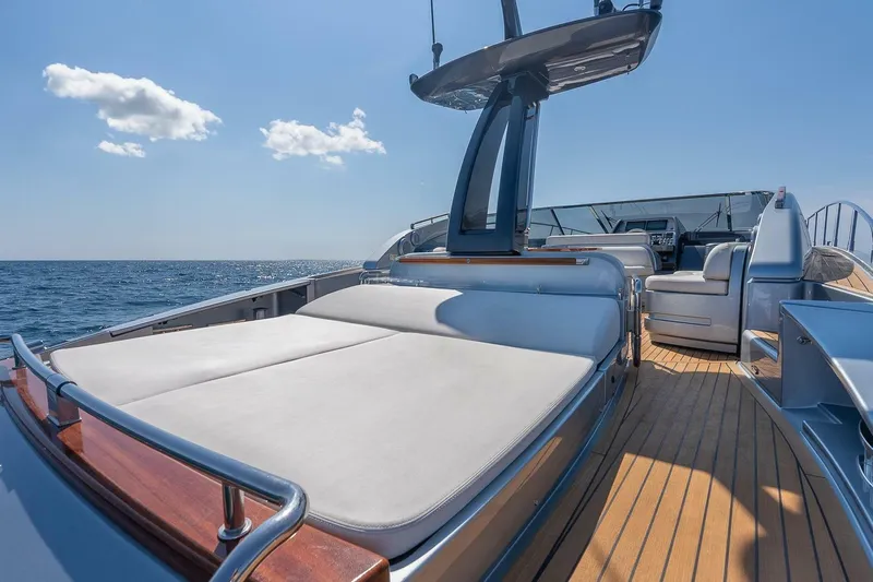 Mild Things Yacht Photos Pics Luxurious 2014 Riva 63 Virtus yacht deck with sunbeds and ocean view.