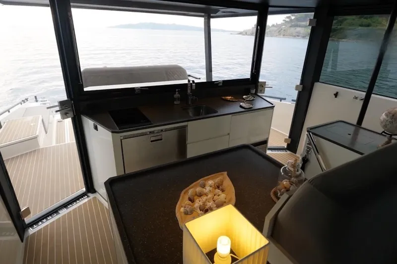  Yacht Photos Pics Luxurious 2019 DutchCraft DC56 yacht interior with modern kitchen and scenic ocean view.