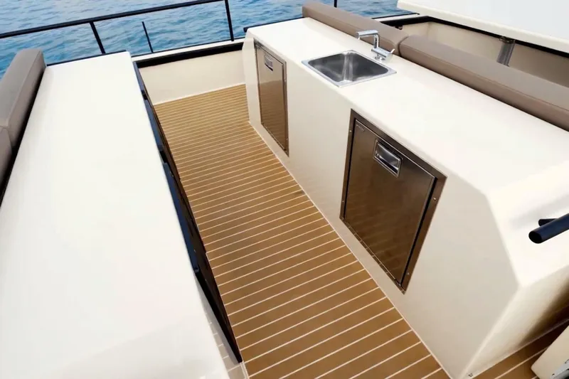  Yacht Photos Pics 2019 DutchCraft DC56 yacht deck with sink and storage, featuring sleek design and wood flooring.