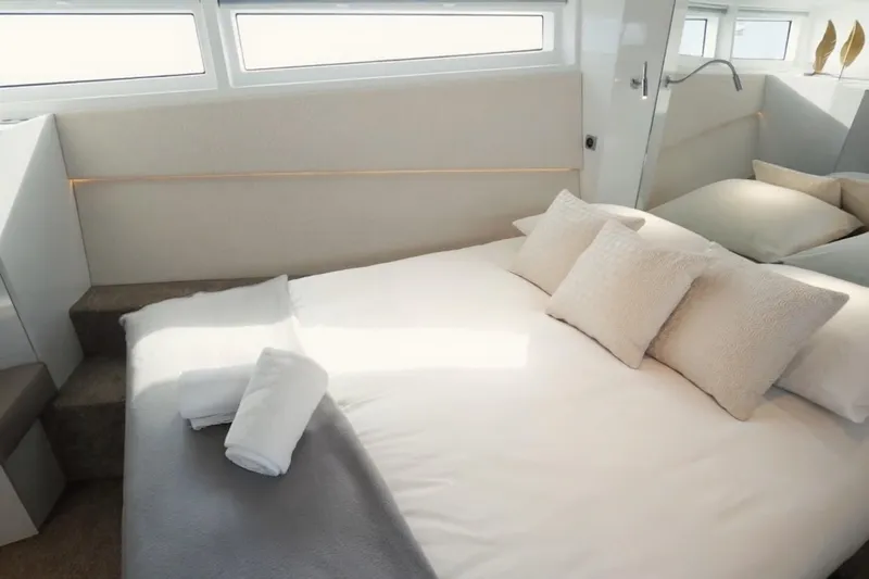  Yacht Photos Pics Luxurious bedroom interior of 2019 DutchCraft DC56 yacht with elegant bedding and natural light.