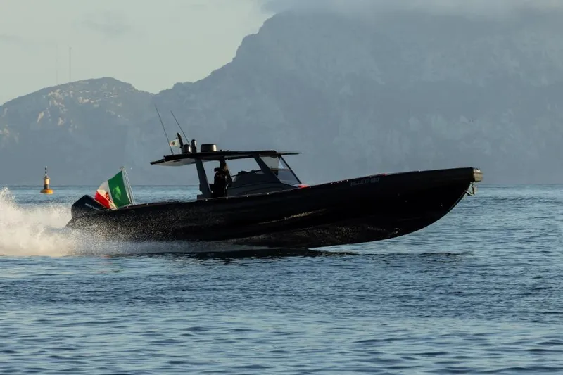  Yacht Photos Pics Novamarine BS 120 FB 2025 speeding on water with mountains in background.