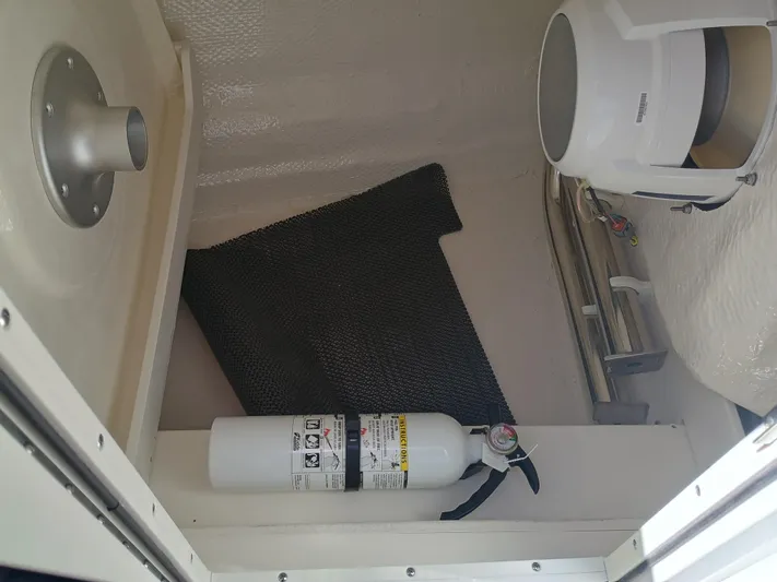 257-155 Yacht Photos Pics 2025 Robalo R257 Dual Console interior with fire extinguisher and storage compartment.