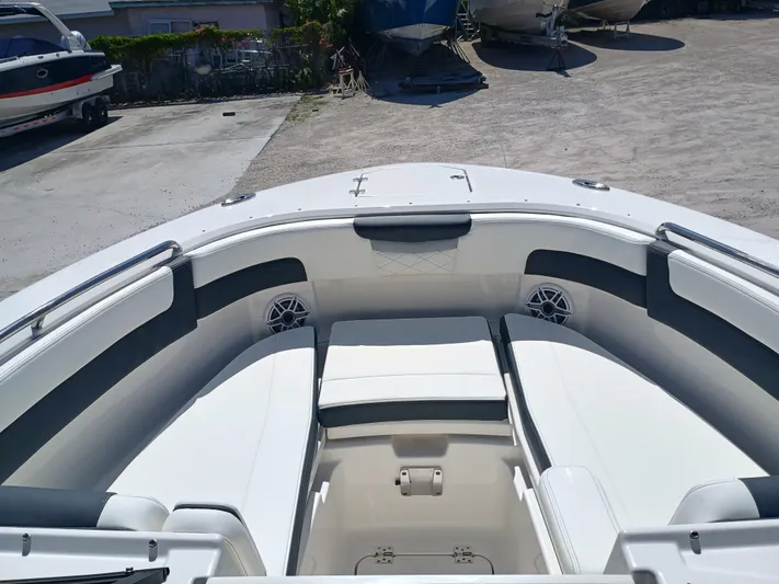 257-155 Yacht Photos Pics 2025 Robalo R257 Dual Console boat interior with white seating and storage compartments.