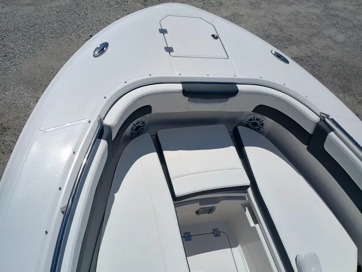 257-155 Yacht Photos Pics 2025 Robalo R257 Dual Console boat interior with white seating and storage compartments.