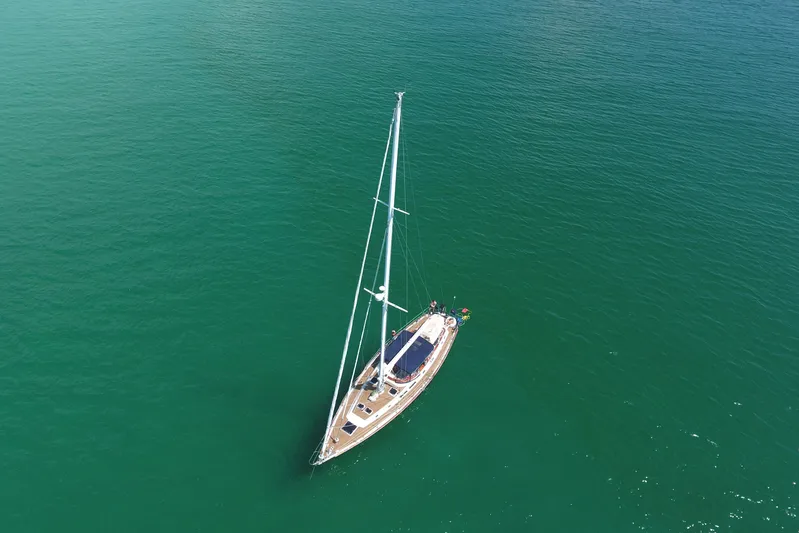 Independence Yacht Photos Pics Aerial view of 1981 Gulfstar 60 CC sailboat on calm green water.