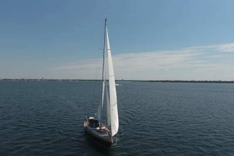 Independence Yacht Photos Pics 1981 Gulfstar 60 CC sailboat cruising on open water under clear blue skies.