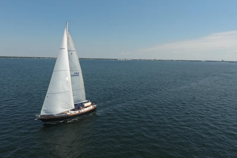 Independence Yacht Photos Pics Sailing yacht Gulfstar 60 CC (1981) cruising on open water under clear skies.