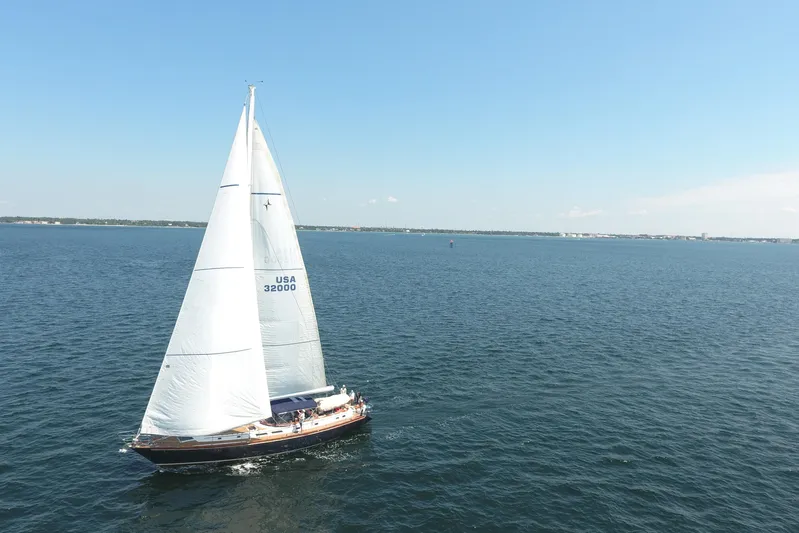 Independence Yacht Photos Pics 1981 Gulfstar 60 CC sailboat cruising on open water under clear blue skies.