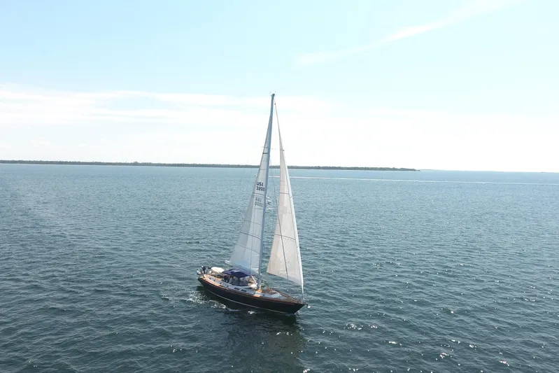 Independence Yacht Photos Pics Sailing yacht Gulfstar 60 CC, 1981 model, cruising on open water under clear skies.