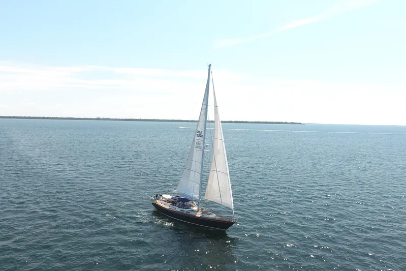 Independence Yacht Photos Pics Sailing yacht Gulfstar 60 CC, 1981 model, cruising on open water under clear skies.