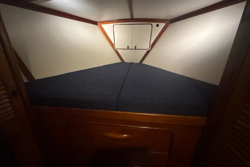 Independence Yacht Photos Pics Cozy cabin interior of 1981 Gulfstar 60 CC sailboat with polka dot bedding.