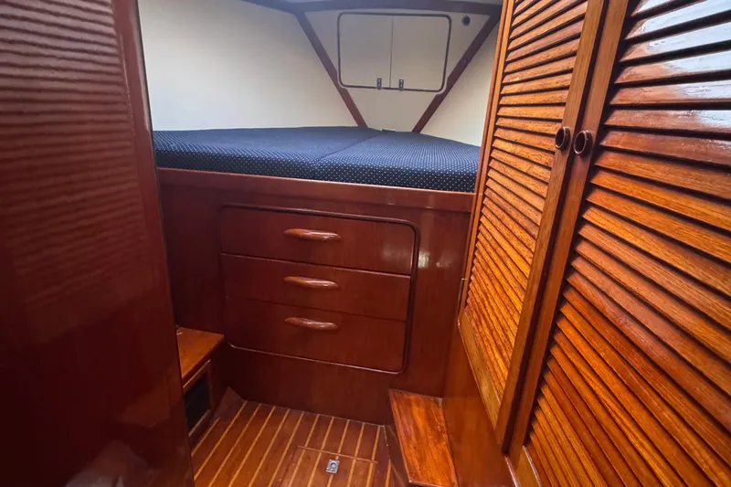 Independence Yacht Photos Pics Cozy cabin interior of 1981 Gulfstar 60 CC with wooden furnishings and storage.