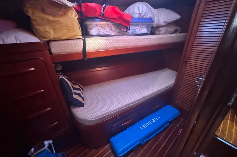 Independence Yacht Photos Pics Cozy cabin interior of 1981 Gulfstar 60 CC with bunk beds and storage.