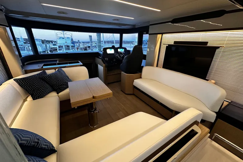  Yacht Photos Pics Luxurious interior of 2020 Absolute NAVETTA 48 yacht with modern seating and helm.