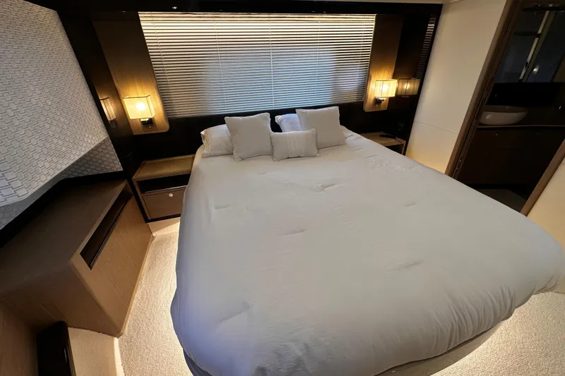  Yacht Photos Pics Luxurious bedroom interior of 2020 Absolute NAVETTA 48 yacht with modern decor.