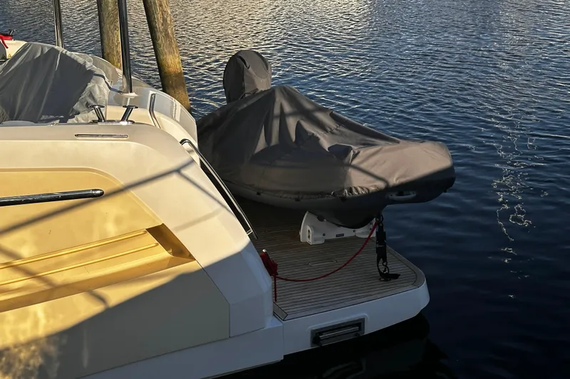  Yacht Photos Pics Luxury yacht Absolute NAVETTA 48, 2020 model, docked with covered equipment on deck.