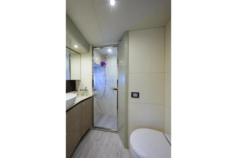  Yacht Photos Pics Luxurious bathroom interior on 2020 Absolute NAVETTA 48 yacht, featuring modern fixtures and elegant design.