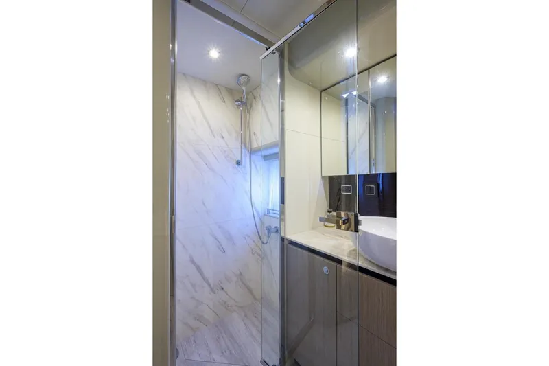  Yacht Photos Pics Luxurious bathroom in 2020 Absolute NAVETTA 48 yacht with modern shower and sleek design.