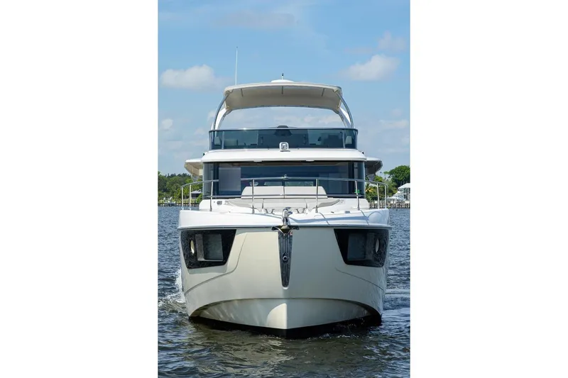  Yacht Photos Pics Front view of 2020 Absolute NAVETTA 48 yacht on water under blue sky.