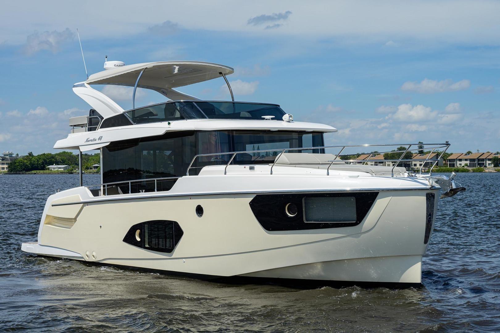 Luxury 2020 Absolute NAVETTA 48 yacht cruising on a sunny day.