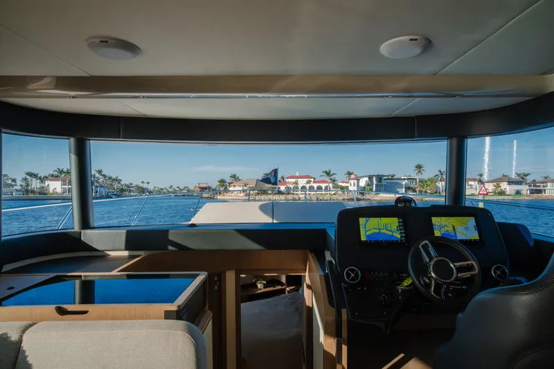  Yacht Photos Pics Interior view of 2020 Absolute NAVETTA 48 yacht's helm with navigation screens.
