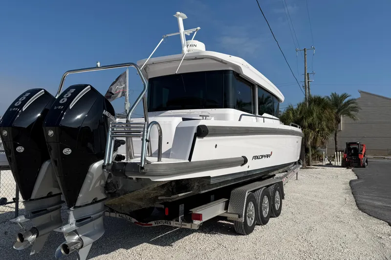  Yacht Photos Pics 2023 Axopar 37 XC CROSS CABIN boat on trailer with dual engines.