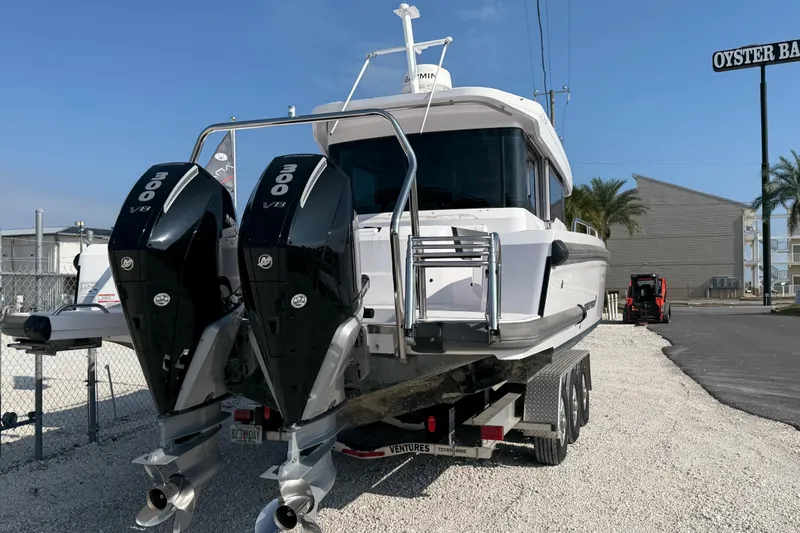  Yacht Photos Pics 2023 Axopar 37 XC CROSS CABIN with dual 300 V8 engines on a trailer.