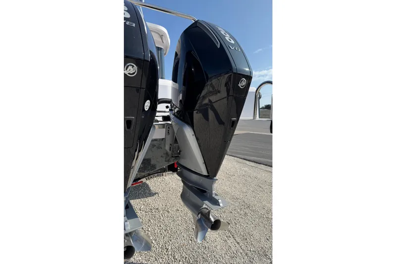  Yacht Photos Pics 2023 Axopar 37 XC CROSS CABIN with dual outboard engines, rear view.