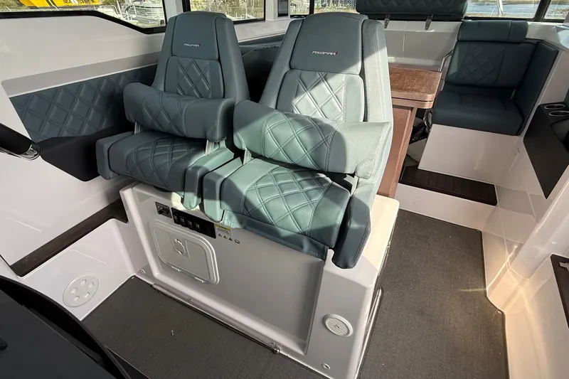  Yacht Photos Pics Interior of 2023 Axopar 37 XC CROSS CABIN with luxurious seating and modern design.