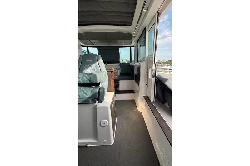  Yacht Photos Pics Interior view of 2023 Axopar 37 XC CROSS CABIN, featuring modern seating and design.