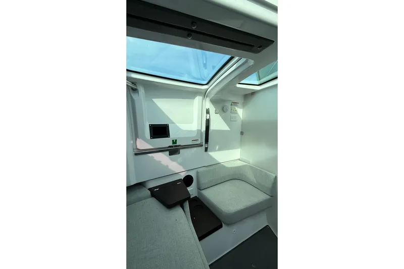 Yacht Photos Pics Interior of 2023 Axopar 37 XC CROSS CABIN with seating and skylight.