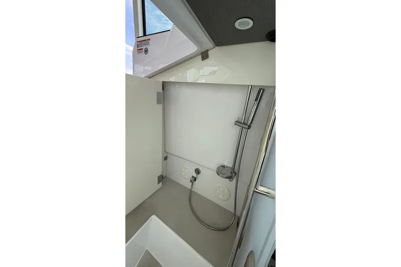  Yacht Photos Pics 2023 Axopar 37 XC CROSS CABIN bathroom with modern shower design.