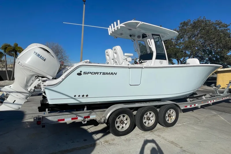  Yacht Photos Pics 2025 Sportsman Heritage 261 Center Console boat on trailer, featuring Yamaha engine.