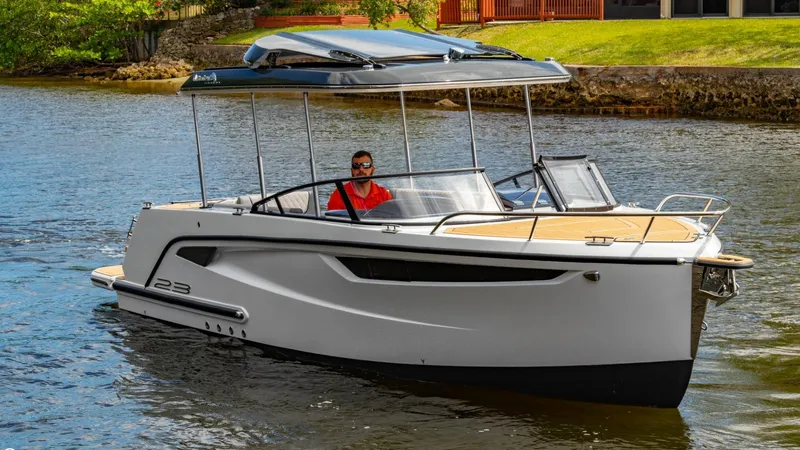  Yacht Photos Pics 2023 Alfastreet 23 Cabin Electric boat cruising on a calm river.