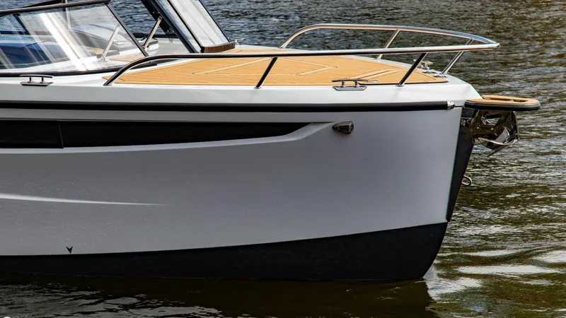  Yacht Photos Pics 2023 Alfastreet 23 Cabin Electric boat on water, close-up of bow and deck.