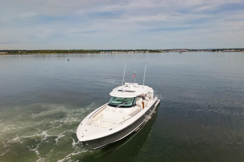 Str8to Yacht Photos Pics 2025 Tiara Yachts 43 LS cruising on calm waters under a clear sky.