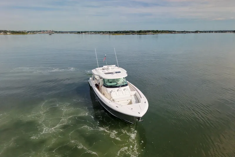 Str8to Yacht Photos Pics 2025 Tiara Yachts 43 LS cruising on calm waters under a clear sky.
