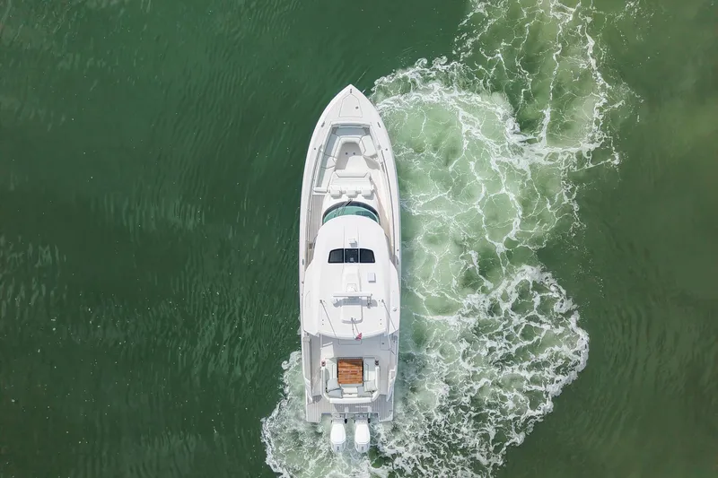 Str8to Yacht Photos Pics Aerial view of 2025 Tiara Yachts 43 LS cruising on green water.