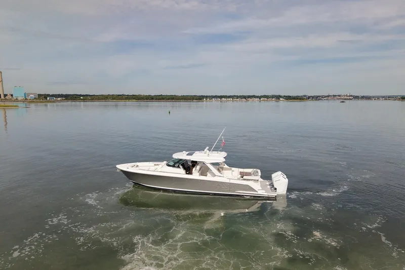 Str8to Yacht Photos Pics 2025 Tiara Yachts 43 LS cruising on calm waters under a clear sky.
