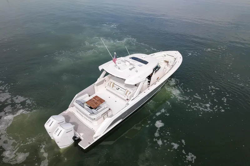 Str8to Yacht Photos Pics 2025 Tiara Yachts 43 LS cruising on calm waters, aerial view.