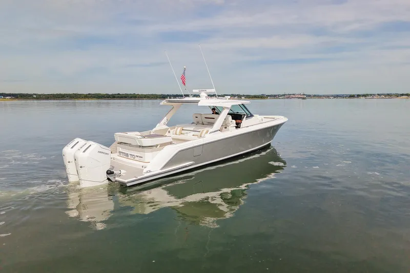 Str8to Yacht Photos Pics 2025 Tiara Yachts 43 LS cruising on calm waters, showcasing sleek design and powerful engines.