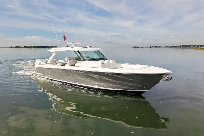 Str8to Yacht Photos Pics 2025 Tiara Yachts 43 LS cruising on calm waters under a clear sky.