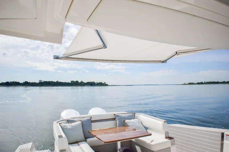 Str8to Yacht Photos Pics 2025 Tiara Yachts 43 LS with elegant seating and scenic water view.