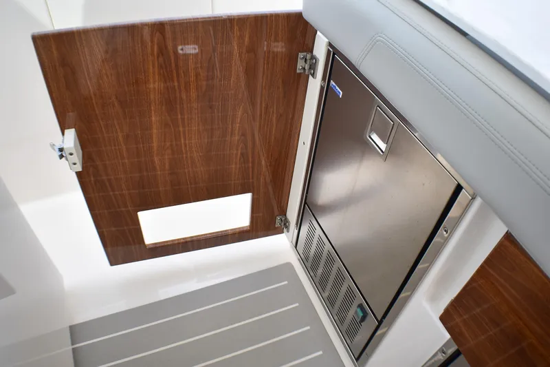 Str8to Yacht Photos Pics 2025 Tiara Yachts 43 LS interior with wood paneling and stainless steel appliance.