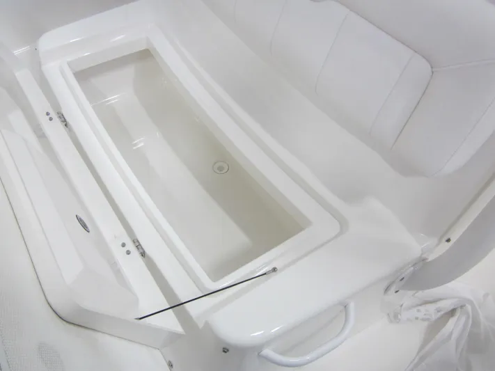  Yacht Photos Pics 2018 Regulator 28 Center Console interior with seating and storage compartment.