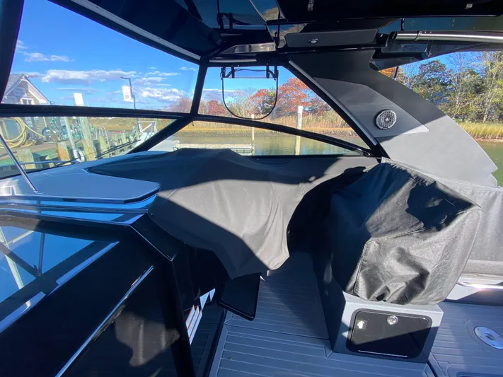  Yacht Photos Pics 2023 Cruisers Yachts 34 GLS OB interior with covered seating and sleek design.