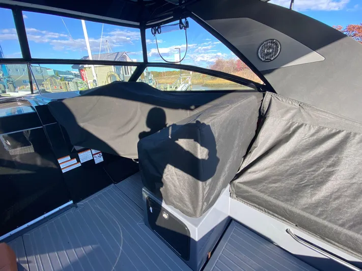  Yacht Photos Pics 2023 Cruisers Yachts 34 GLS OB interior with protective covers and modern design.