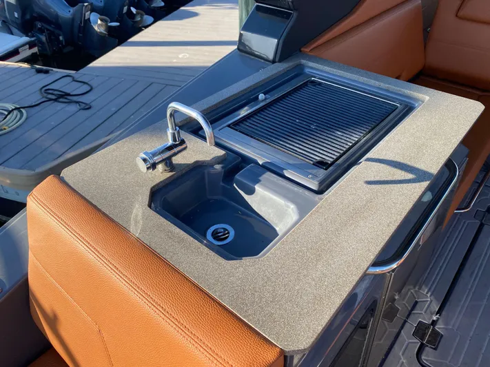  Yacht Photos Pics 2023 Cruisers Yachts 34 GLS OB boat sink and grill on deck.