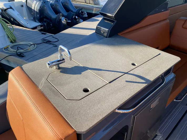  Yacht Photos Pics 2023 Cruisers Yachts 34 GLS OB boat interior with sleek countertop and faucet.