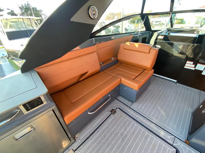  Yacht Photos Pics 2023 Cruisers Yachts 34 GLS OB interior with tan leather seating and modern design.